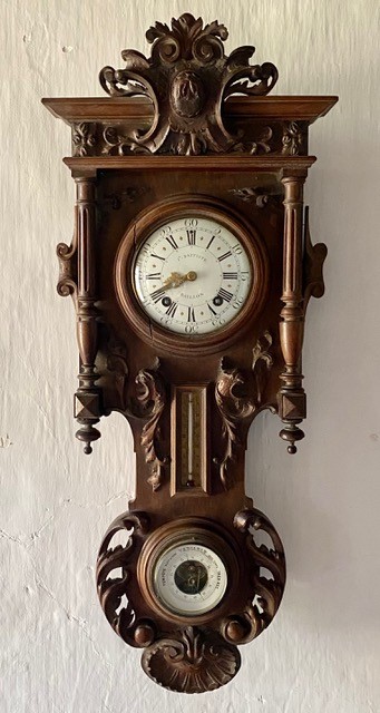 A late 19th century French carved walnut wall clock combined thermometer and barometer, dial and movement marked J Baptiste Baillon, Paris, height 93cm